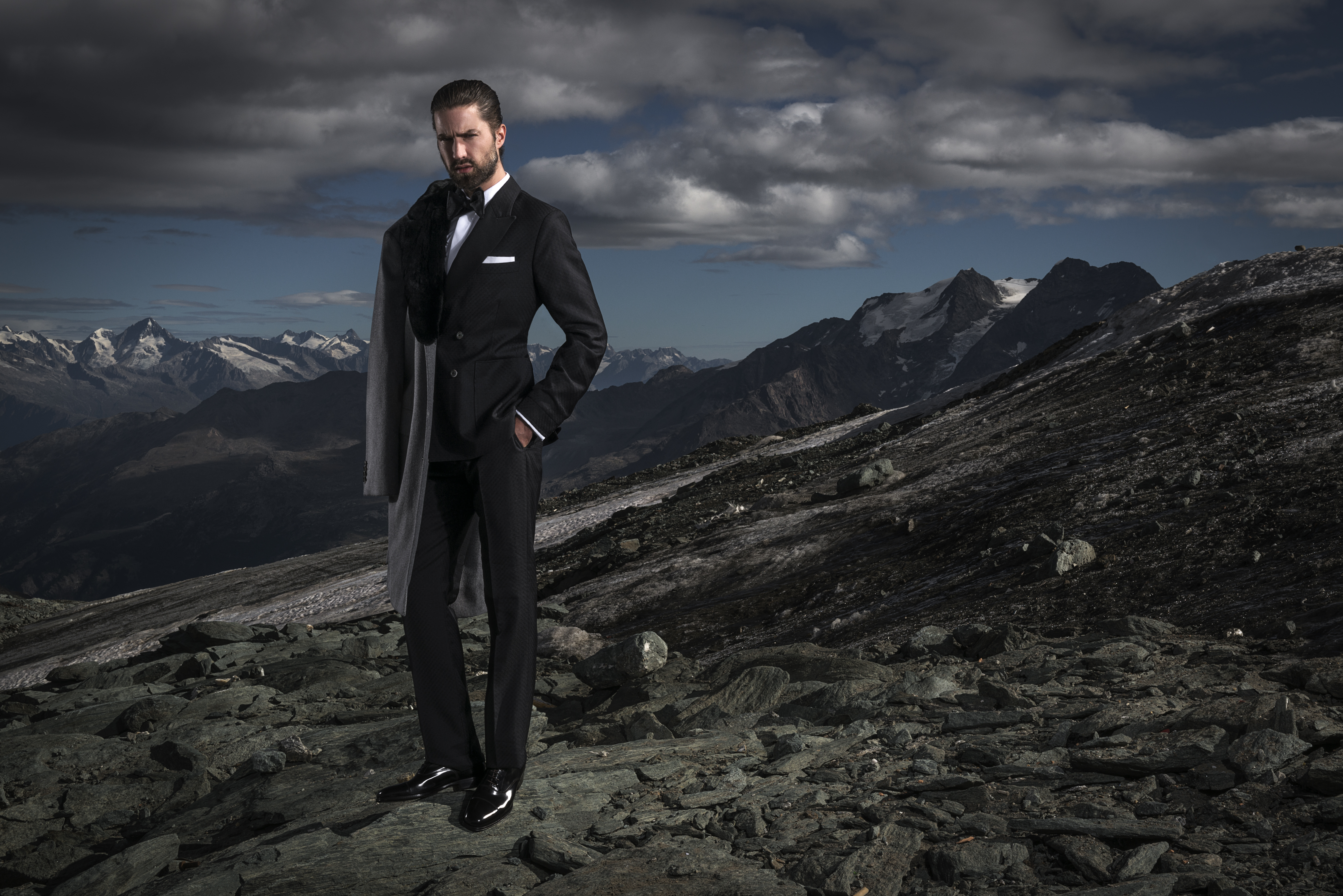 man standing on glacier in a tuxedo Ross Woodhall - Action & Lifestyle Photography