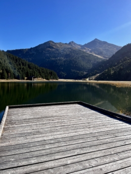 Image of a platform going out to a lake in the mountains during the summer. Ross Woodhall - Action & Lifestyle Photography