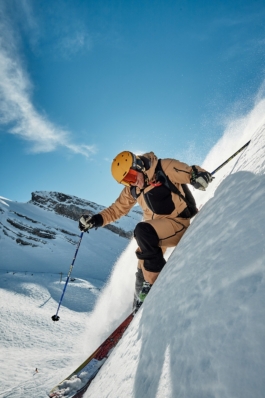 Close up of skier off piste, coming close to the photographer with sun behind him Ross Woodhall - Action & Lifestyle Photography