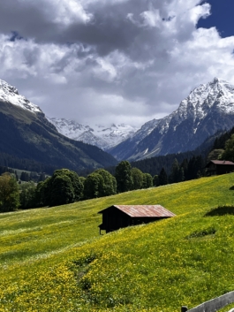 Mountain meadows with old building. Ross Woodhall - Action & Lifestyle Photography