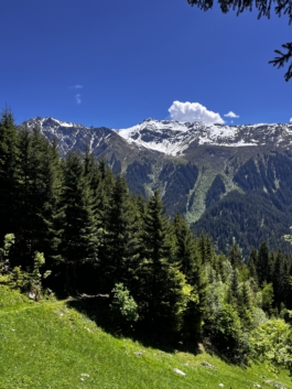 Hikers view across the valley to snow capped mountains. Ross Woodhall - Action & Lifestyle Photography